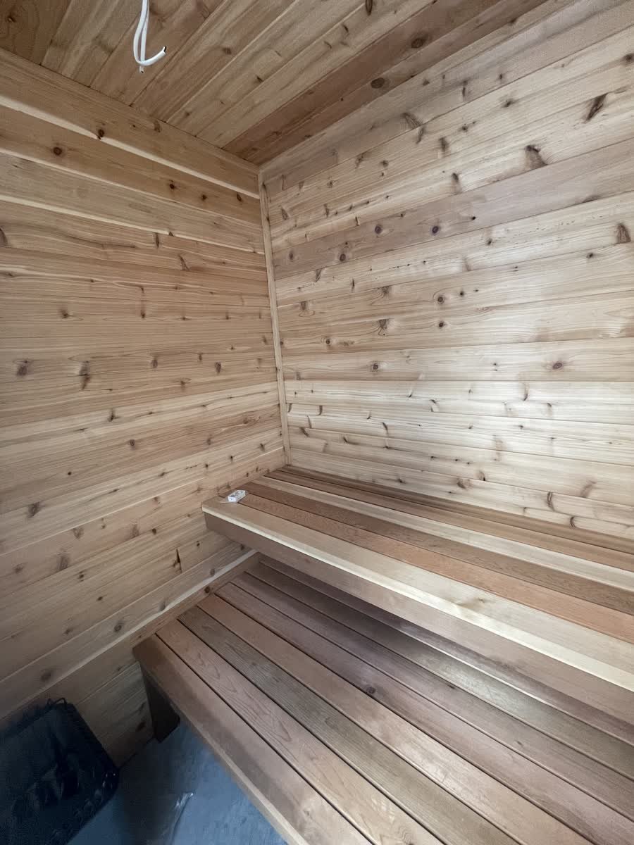 Cedar-lined sauna with two-level slatted benches